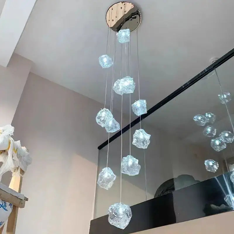 A modern crystal cube chandelier pendant with faceted glass orbs and chrome fixture for dining room pendant lights