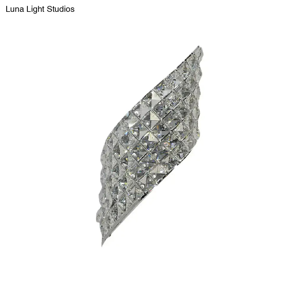 Modern crystal diamond wall mounted lamp in silver with faceted crystal squares and curved design for bedroom use