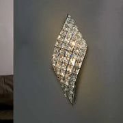 Modern crystal diamond wall mounted lamp with clear faceted crystals and polished silver frame for bedroom lighting
