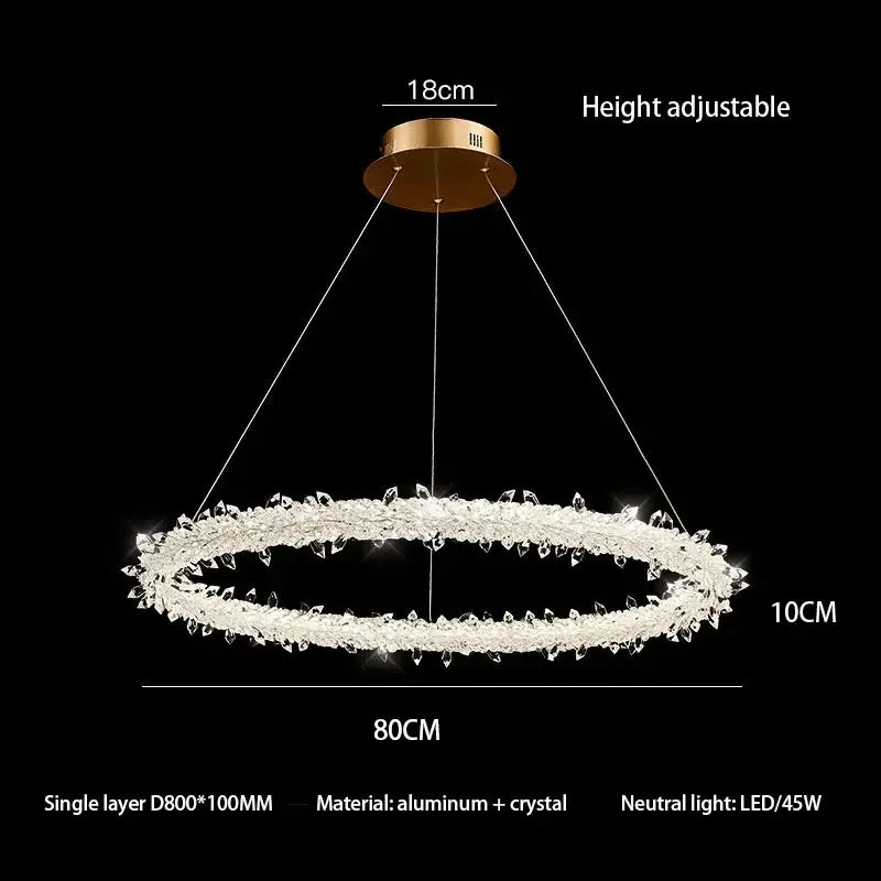Modern crystal flower led chandelier with gold-toned mount and 80cm ring adorned with clear faceted crystals by decorbites