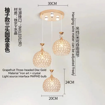 Modern crystal gold ceiling chandelier featuring a gold-colored grapefruit-shaped three-headed iron art and crystal design with a 9w pmd bulb