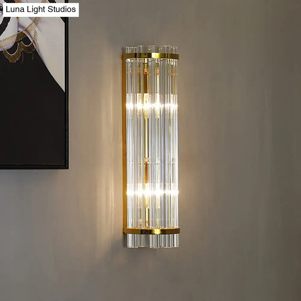 Elegant wall sconce with vertical crystal rods and polished gold finish for modern wall lighting in bedrooms