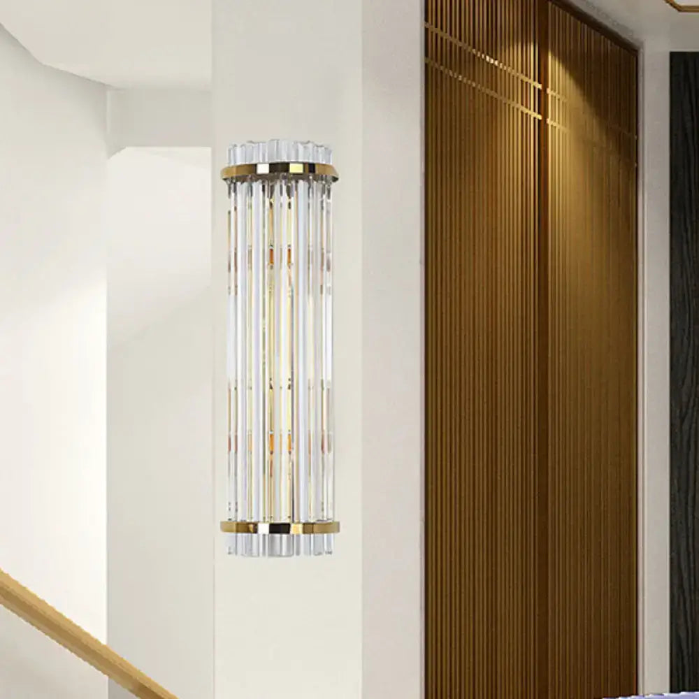 Elegant modern crystal gold finish wall lighting sconce with clear crystal rods and polished gold-toned metal bands
