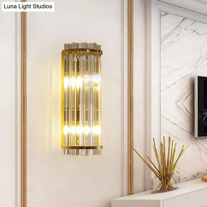 Modern crystal gold finish wall lighting featuring a gold finish wall sconce with vertical crystal rods