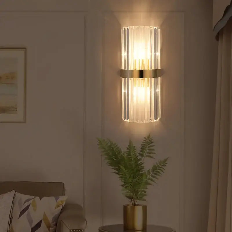 Modern crystal gold led wall lamp with cylindrical crystal prisms and polished gold band for bedroom lighting decorbites crystal gold