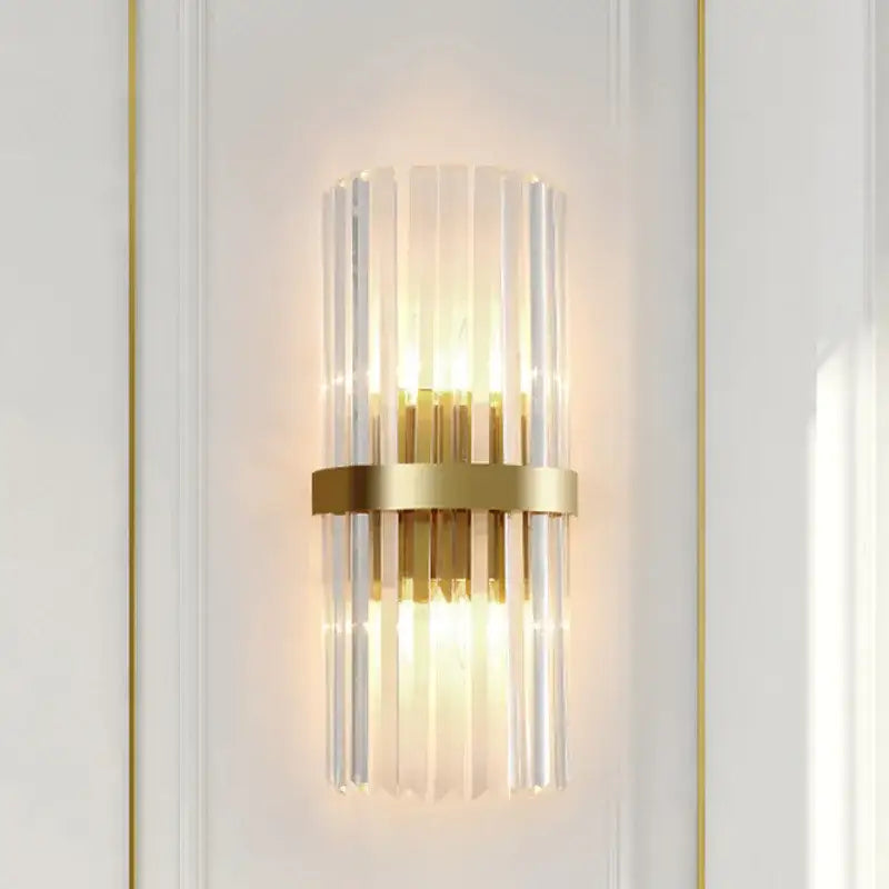Modern crystal gold led wall sconce featuring gold-toned vertical glass rods and a central brass ring by decorbites crystal gold