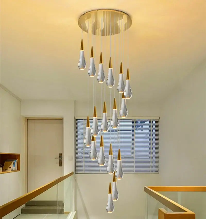 Elegant modern crystal gold pendant lights featuring cascading teardrop-shaped crystal gold pendants for dining room decorbites chandelier