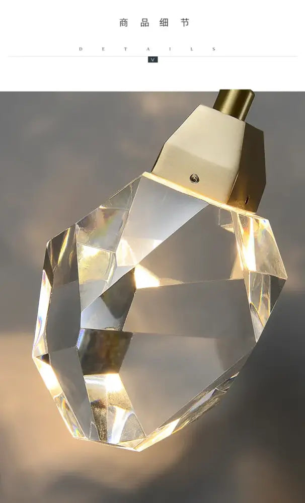 A faceted crystal golden wall sconce with a gold-toned metal cap for warm bedroom decorbites crystal golden lighting