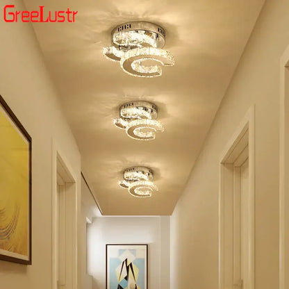 Three sleek modern decorbites crystal led ceiling lamps with crystal rings and chrome base for living room decor