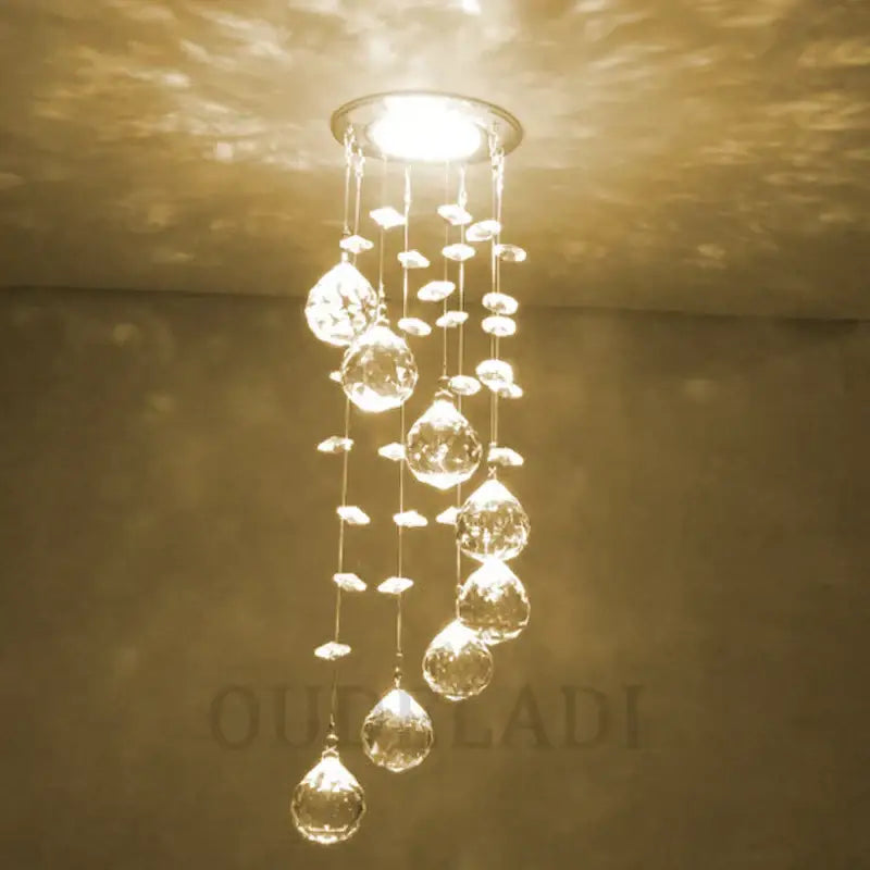A modern crystal led downlight ceiling lamp with cascading teardrop glass pendants for living room decorbites crystal led