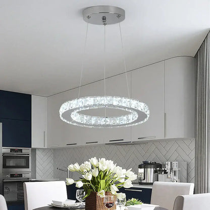 Modern crystal led pendant chandelier with clear crystal accents and sleek chrome finish for dining room decorbites crystal led