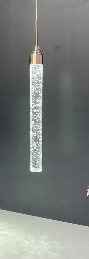 A modern crystal led pendant light with a clear glass body filled with beads and polished brass top for dining room decorbites crystal led