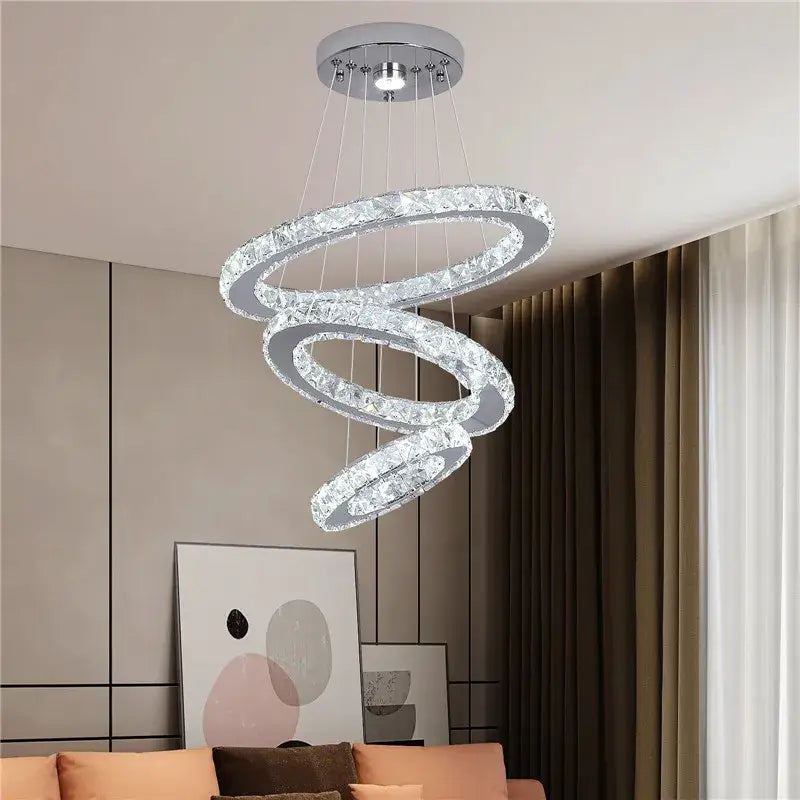 Modern crystal led ring pendant chandelier with three interlocking chrome rings encrusted in clear crystals for dining room decorbites crystal led