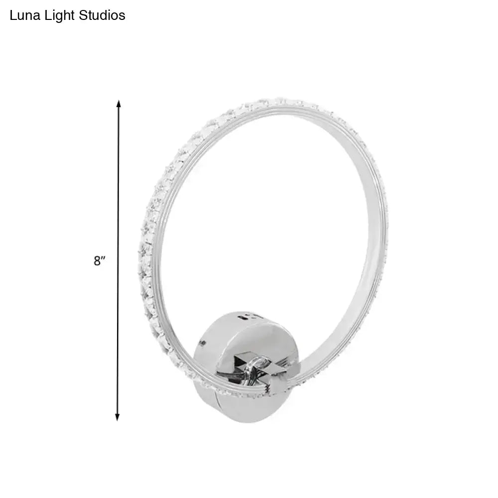 Modern crystal led wall sconce with silver chrome finish and sparkling clear crystals for bedroom lighting