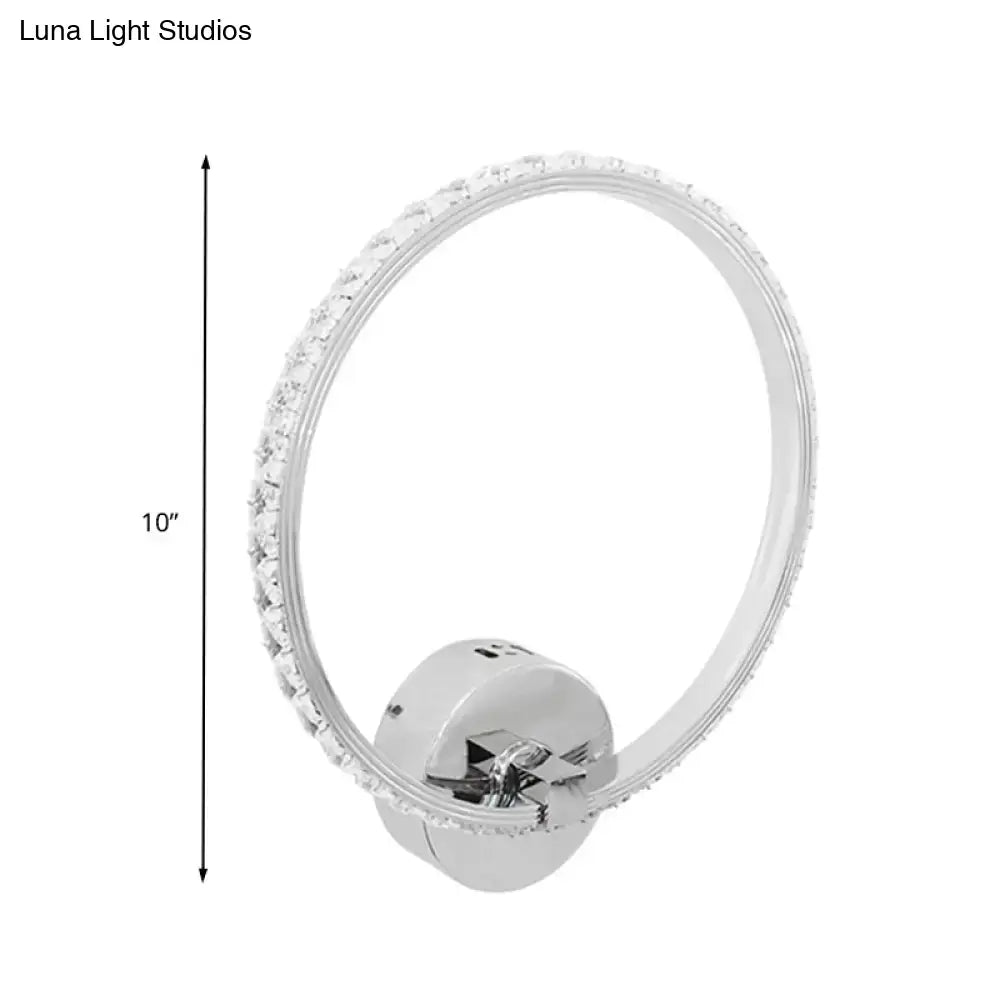 Modern crystal led wall sconce with a chrome finish and sparkling clear crystals for bedroom lighting