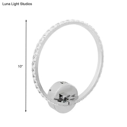 Modern crystal led wall sconce with a chrome finish and sparkling clear crystals for bedroom lighting
