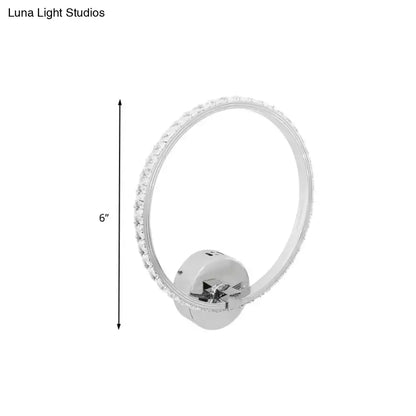 Modern crystal led wall sconce with chrome finish, 6-inch circular design, and outer ring of clear crystals for bedrooms