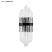 Modern crystal prism wall sconce with clear glass tubes and a black metal square backplate for living room lighting