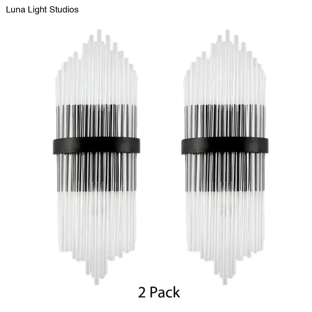 Modern black and clear glass wall sconces with a metal square backplate and vertical rods for living room lighting