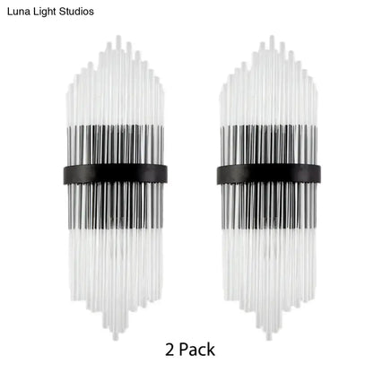 Modern black and clear glass wall sconces with a metal square backplate and vertical rods for living room lighting