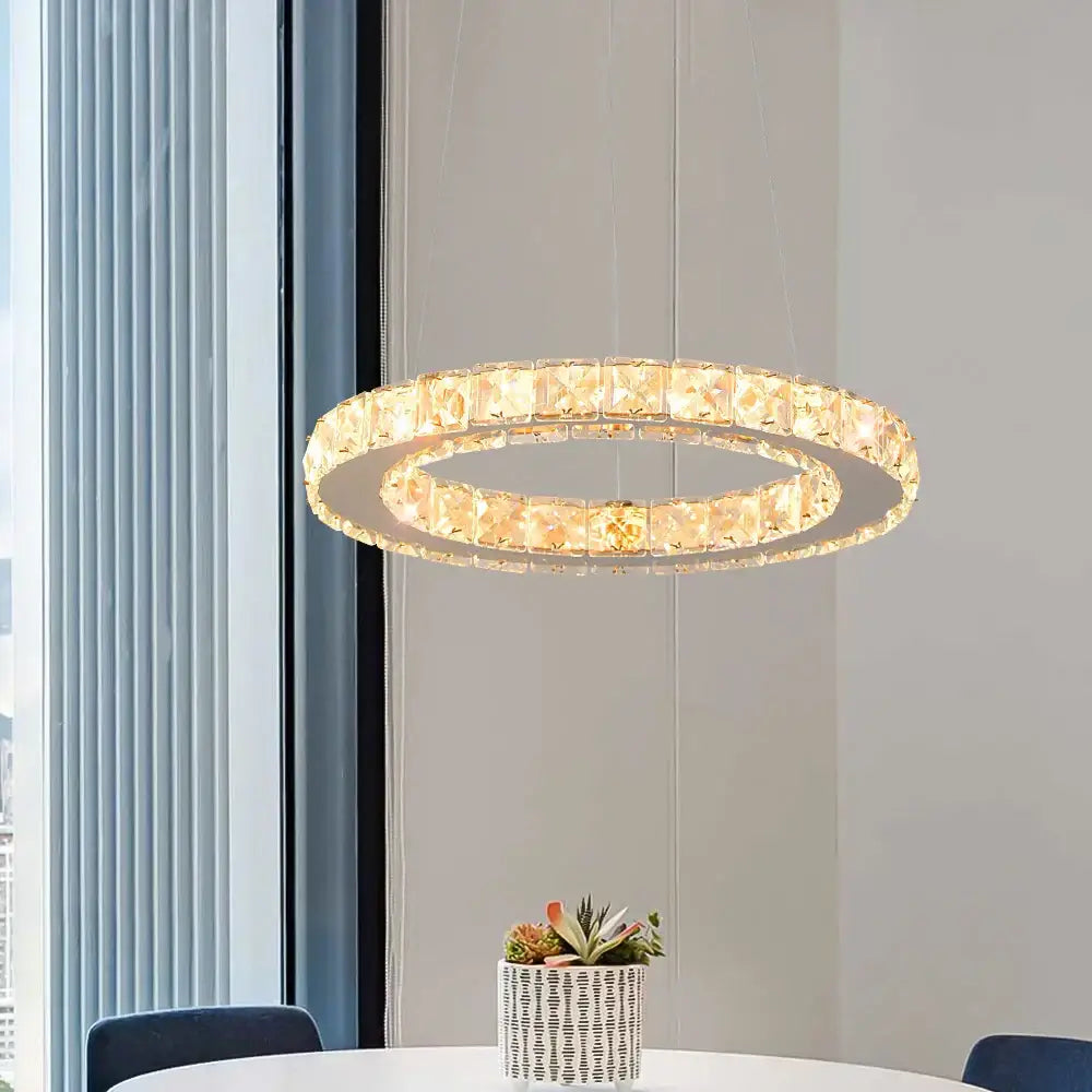 Modern crystal rings led pendant light featuring double-ring faceted crystal elements with warm lighting decorbites crystal rings