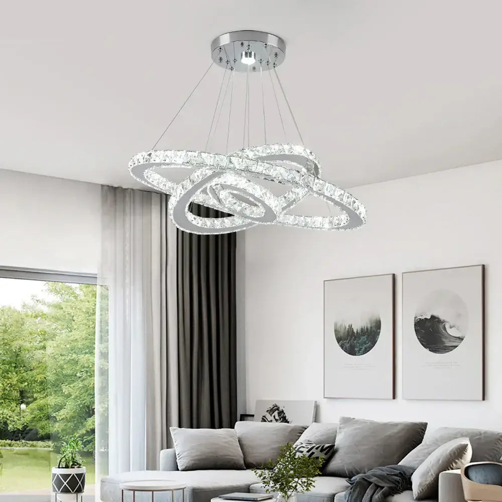 Modern crystal rings led pendant light with interlocking chrome rings and clear crystals for elegant dining room decorbites chandelier