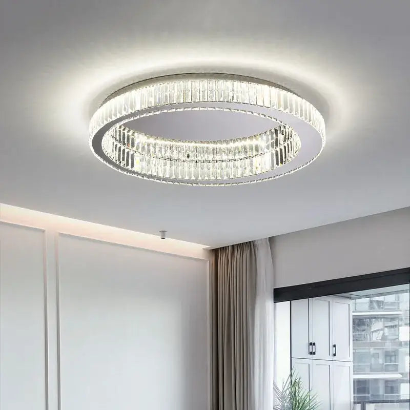 Modern crystal round ceiling lamp with two concentric rings of clear faceted crystals in a silver frame ceiling lamp