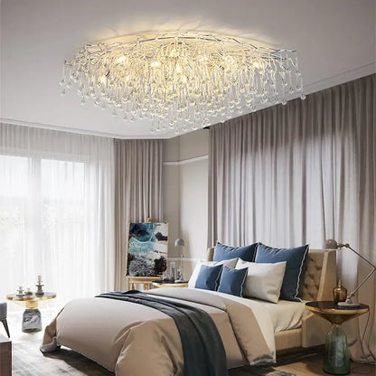 Modern crystal teardrop gold chandelier with intricate crystal droplets and a metallic frame for elegant living room decorbites