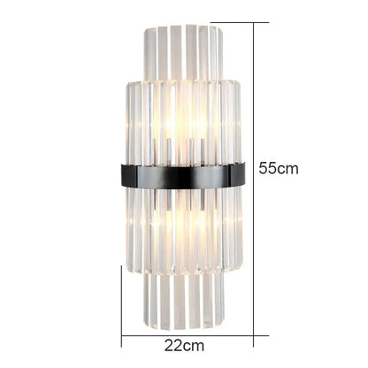 Modern crystal wall lamp with stacked clear crystal rods and black metal band illuminated by warm light for living room decorbites wall lamp