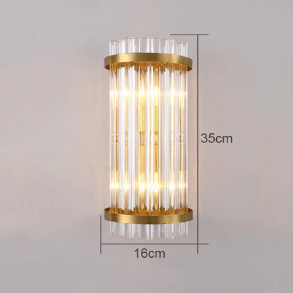 Modern gold-toned wall lamp with vertical clear glass rods and cylindrical design for living room decorbites crystal wall