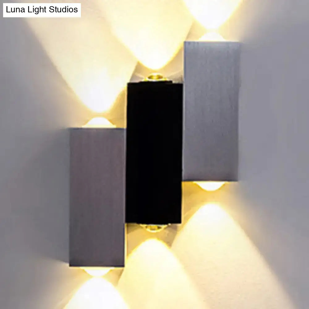 Modern cubic silver and black wall sconce with brushed panels direct wired electric maximum bulb wattage for porch use