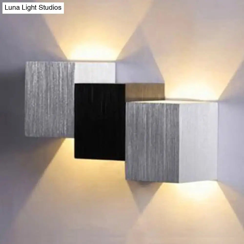 Modern cubic silver and black direct wired electric wall sconce with brushed metallic finish and maximum bulb wattage use