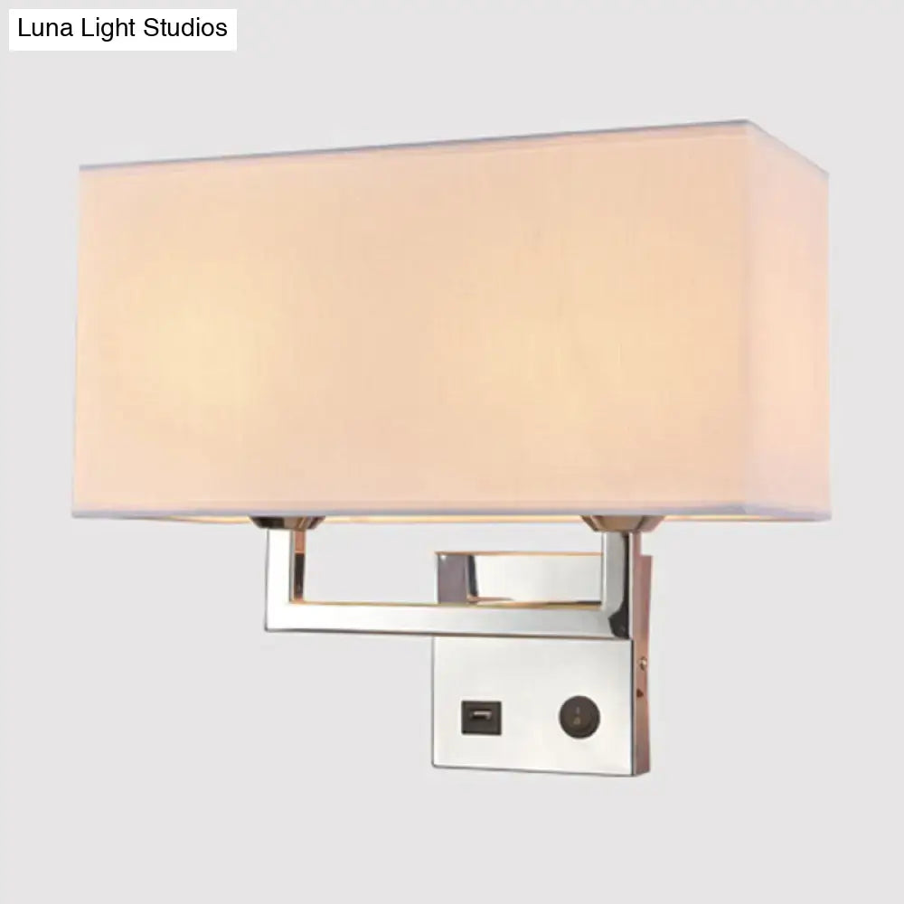 Modern cuboidal fabric wall light with sleek chrome finish and soft beige white fabric shade for living room use