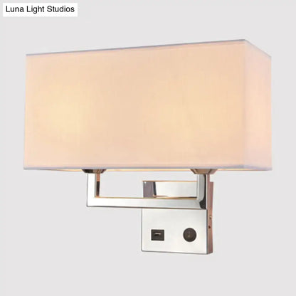 Modern cuboidal fabric wall light with sleek chrome finish and soft beige white fabric shade for living room use