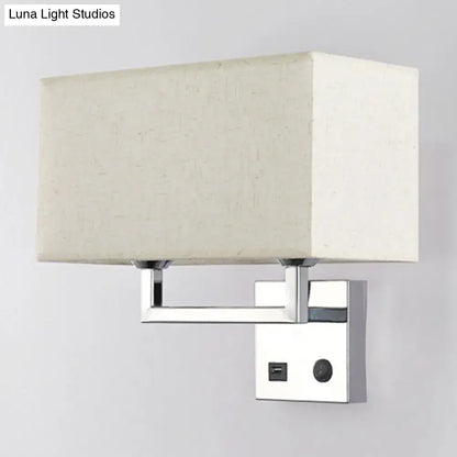 Modern cuboidal fabric wall light with beige white fabric shade and polished chrome finish featuring integrated usb port