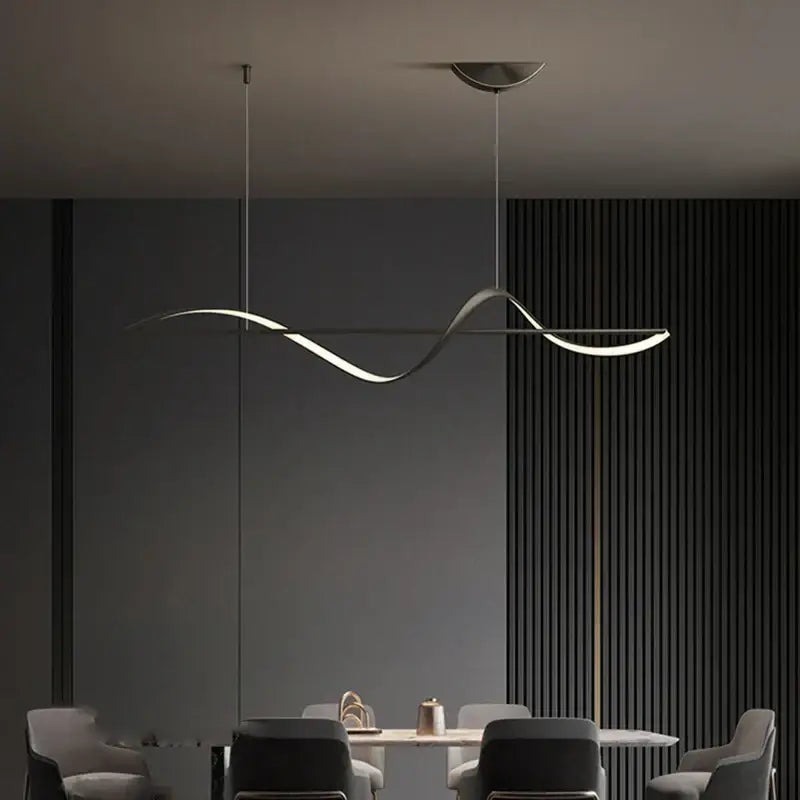 Modern curved gold led pendant light with adjustable height and sleek wave design in brushed metallic finish for dining room