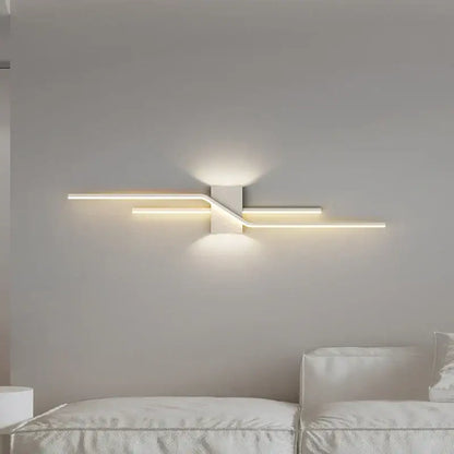 Modern white LED wall lamp with sleek angular design and warm ambient lighting for bedroom decorbites LED wall lamp