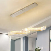 Modern curved crystal chandelier with led silver metal frame and warm glowing lights for dining room ceiling light