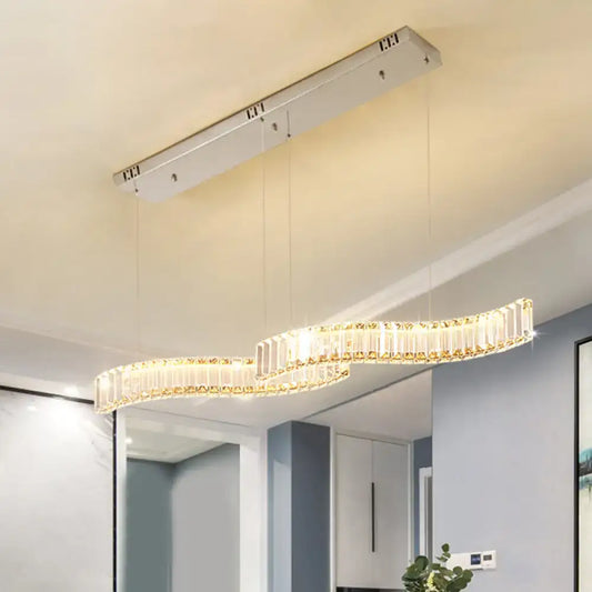 Modern curved crystal chandelier with led silver metal frame and warm glowing lights for dining room ceiling light