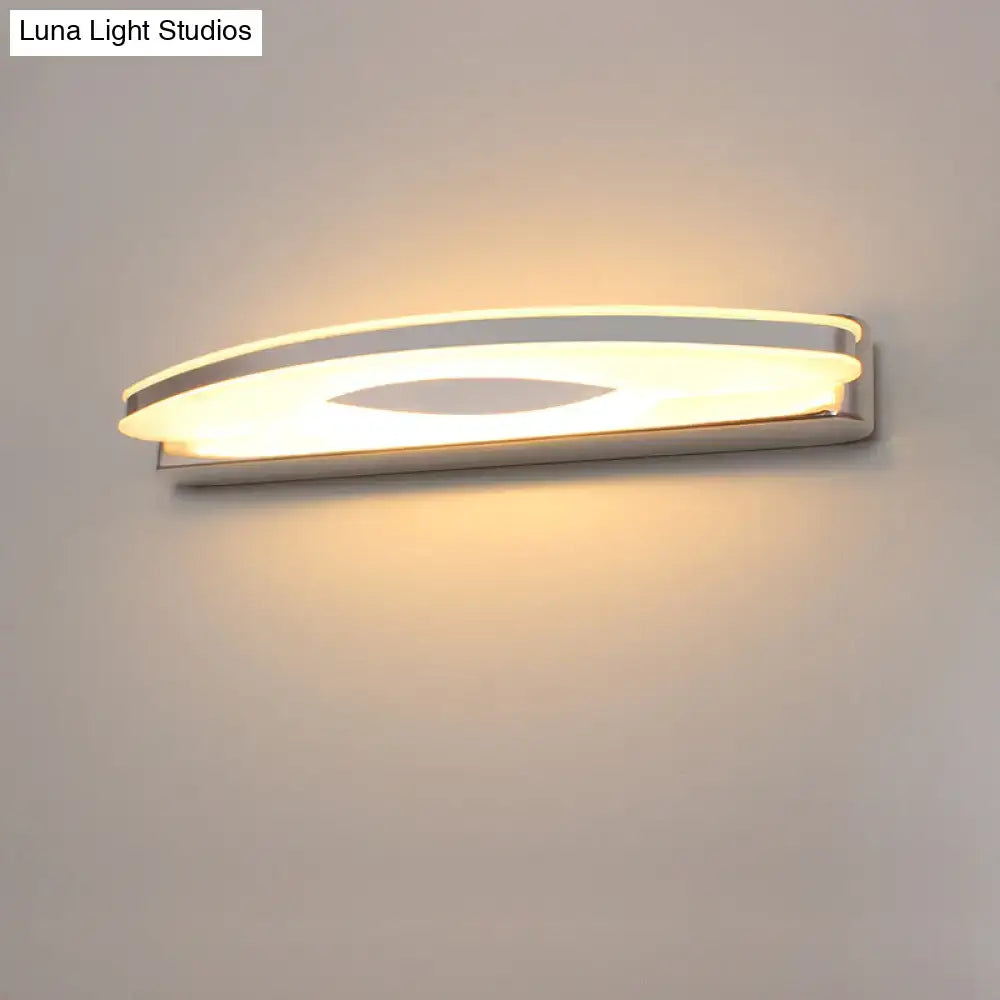 Modern curved led vanity sconce in chrome finish with silver curved led design and warm ambient bathroom lighting