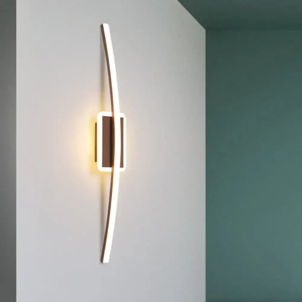 Modern curved linear aluminum LED wall sconce with a sleek gold and coffee finish for dining room lighting