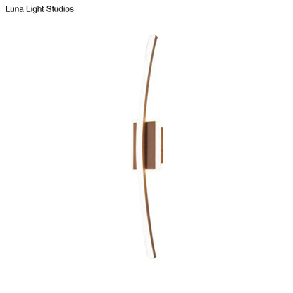 Modern curved linear aluminum wall sconce with sleek curved arms and warm bronze finish for dining room lighting