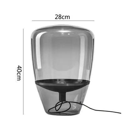 Modern gray translucent decorbites glass table lamp with sleek rounded design and black base for bedroom LED lighting