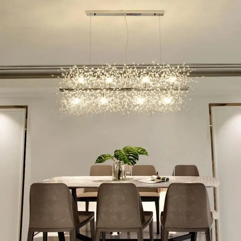 A modern dandelion led crystal chandelier with a sleek metallic frame and clear crystals for dining room decorbites
