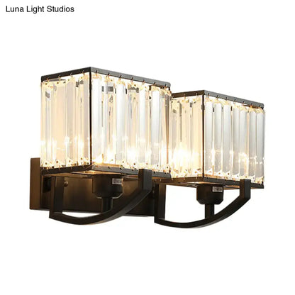 Modern dark bronze wall mount light featuring double-light black metal frames with vertical crystal panels