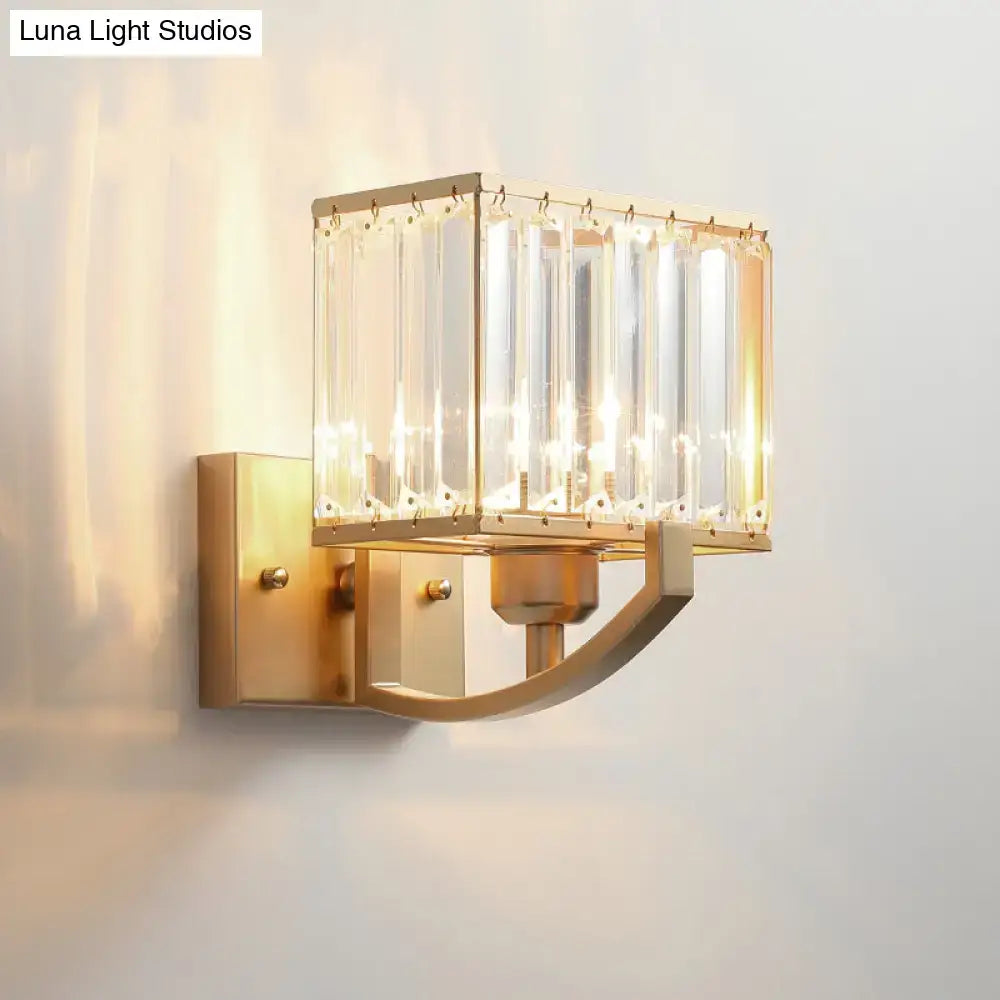 Modern dark bronze wall mount light featuring a gold-toned rectangular frame with vertical crystal rods for bedroom use