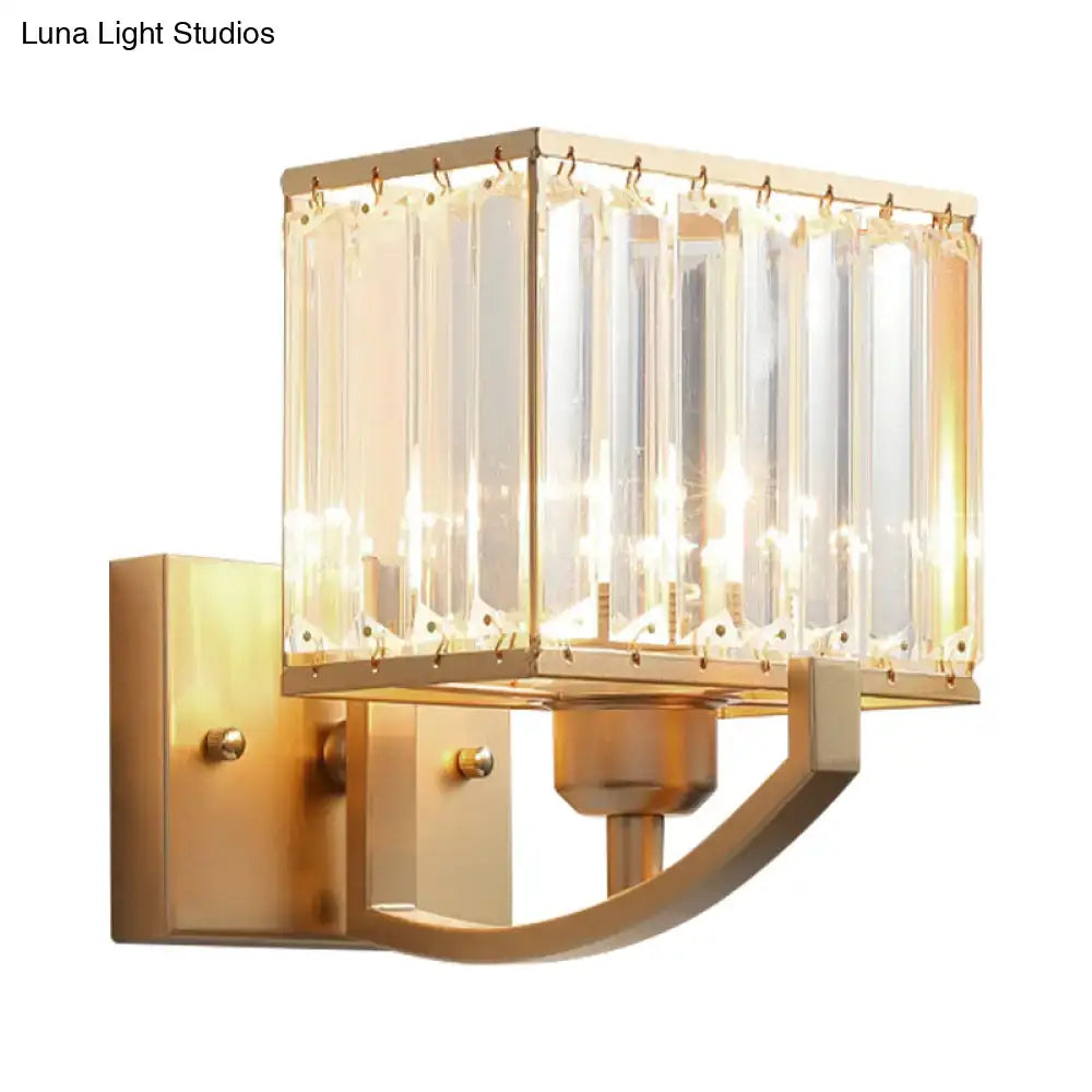 Modern dark bronze wall mount light with gold-toned rectangular design and vertical crystal panels for bedroom use