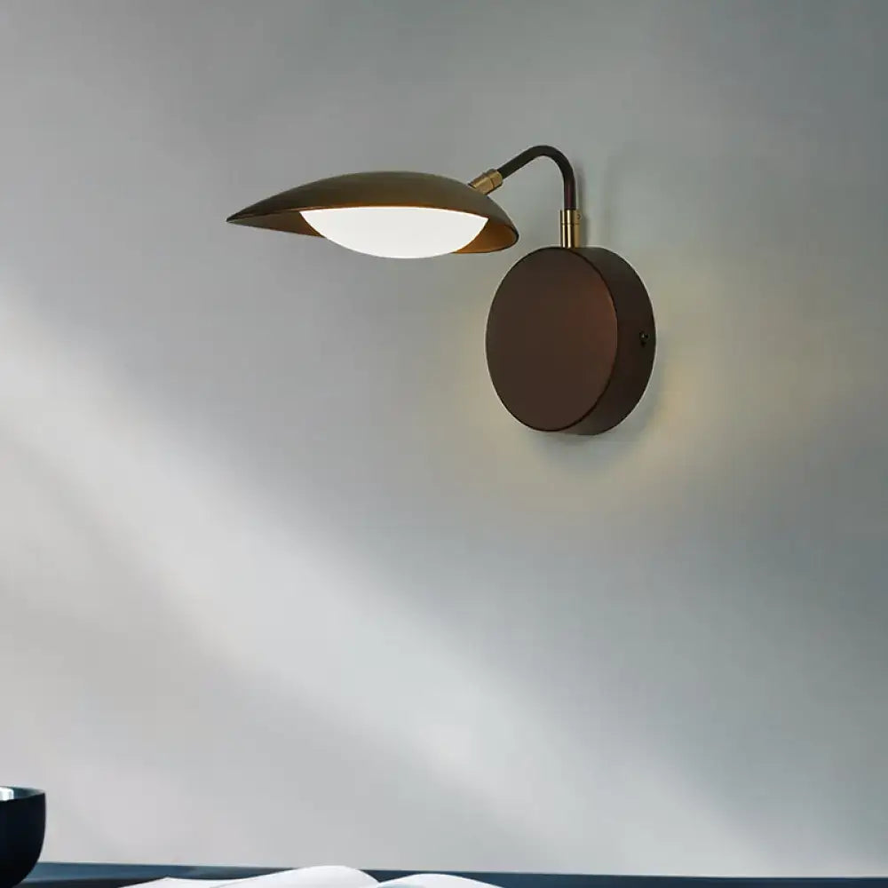 Modern dark bronze oval wall mount sconce with sleek leaf-shaped lampshade and adjustable gooseneck arm LED bedroom light