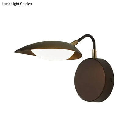 Modern dark bronze oval wall mount sconce with matte bronze finish and adjustable curved arm for bedroom lighting