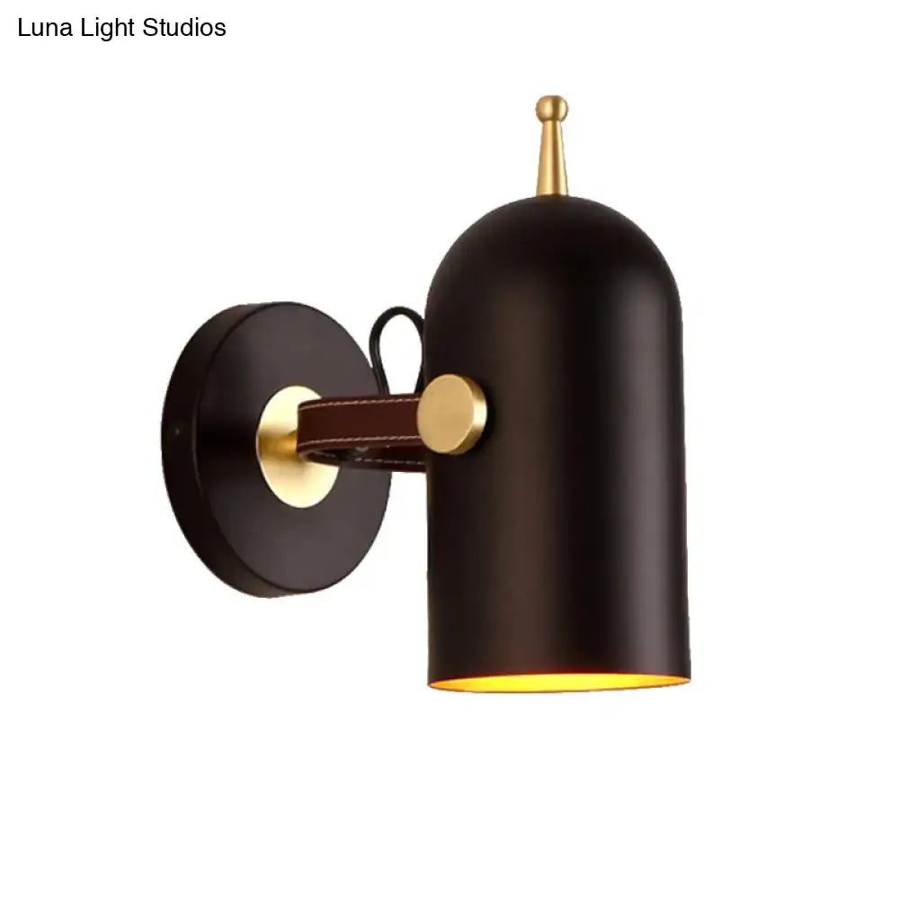 Modern wall lamp with black matte finish brass accents leather strap and cup shade ideal for office corridor lighting
